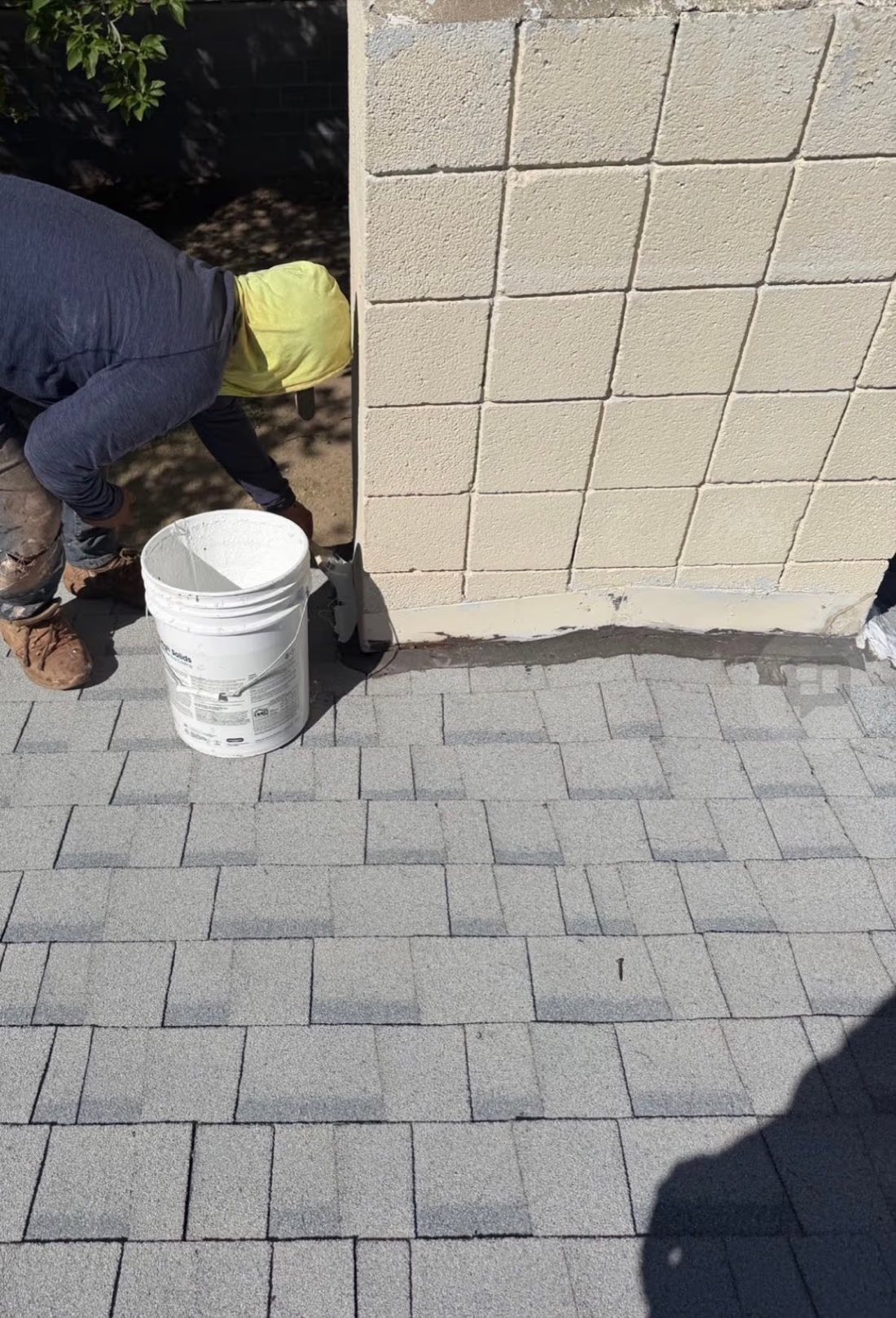 Applying GAF High Solids coating at a parapet wall